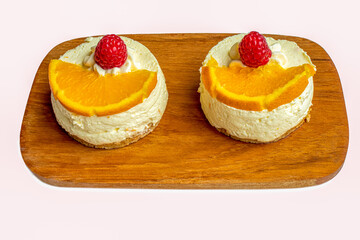 Two individual size raspberry cheese cakes