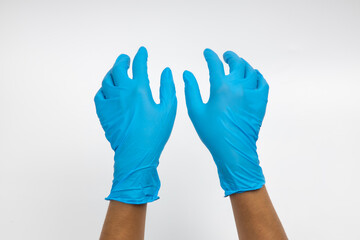 Female hand wears a protective glove for cleaning or tidying. Woman's hand latex glove gesture isolated on white. Female hand putting on latex glove isolated on white background