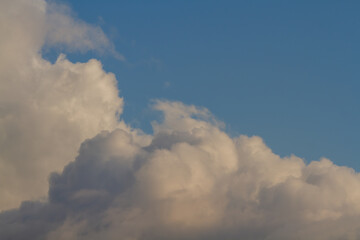 Fototapeta na wymiar Cumulus clouds. Sunset blue sky. Natural background.