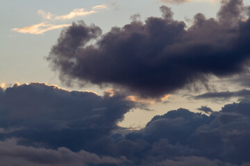 Fototapeta na wymiar Dark blue cumulus clouds. Natural background.