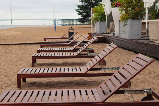 Bad Weather In The City In Summer. Raindrops On Sun Loungers. Closed Cafe. An Empty Beach With No People