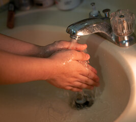 Fototapeta premium washing hands with soap 
