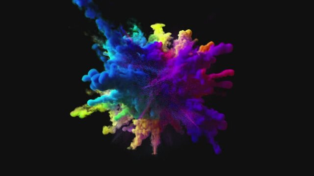Explosion of colorful multicolored smoke and powder in slow motion against black background