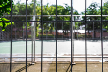 Close-up chain link fence , Sunset background