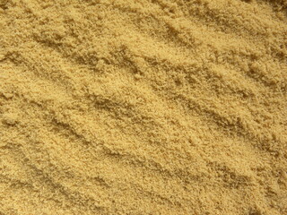 Fototapeta na wymiar Heap of brown color sugar powder