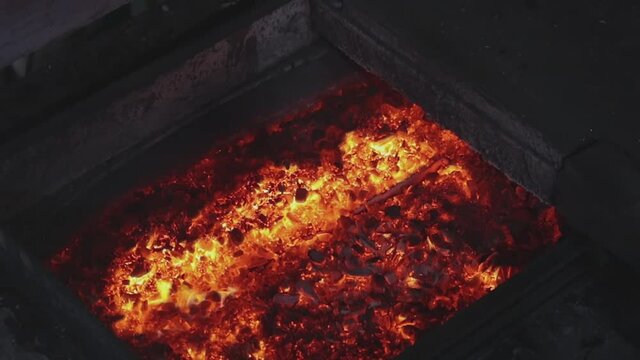 Automated copper feed line to the furnace. The melting of copper in the furnace, the process of melting copper in the furnace.