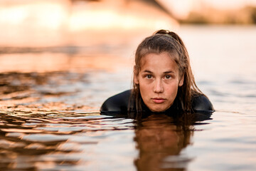 Portrait of young woman with in deep water.