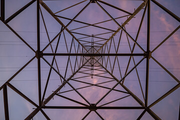 Obraz premium High-voltage mast, steel lattice mast for the transmission of electrical energy from below