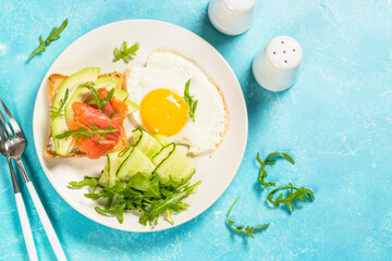 Healthy breakfast with egg, toast and salad.
