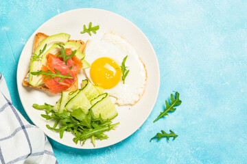 Healthy breakfast with egg, toast and salad.