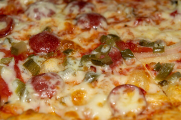 Homemade pizza with sausage, mushrooms and mozzarella cheese. Close up.