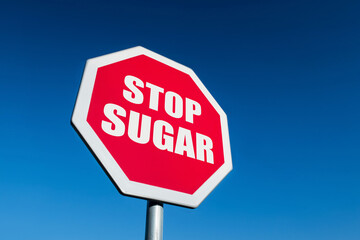 Red STOP traffic sign to cease unhealthy sugar in low-carb keto diet