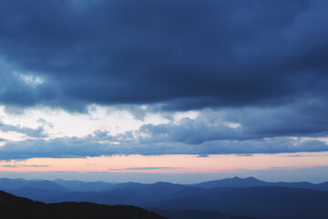 Fototapeta na wymiar Sunset in the cloudy mountains of the Carpathians