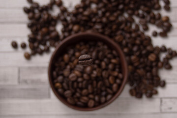 exquisite roasted coffee beans on white background with detail on a bean