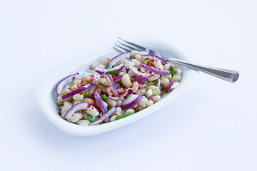 Traditional Turkish Bean,Piyaz Salad in white plate with copy space.