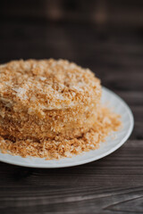 
homemade layer cake with crumb on a dark background