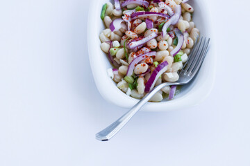 Traditional Turkish Bean,Piyaz Salad in white plate with copy space.
