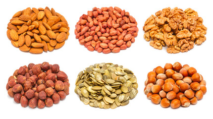 Set of different types of nuts and seeds - almond seeds, peeled peanut, peeled walnut, peeled ripe hazelnuts, pumpkin seeds without shell, ripe hazelnuts in the shell