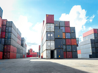 Stack of cargo container box in logistic shipping yard whit blue sky on sunny day