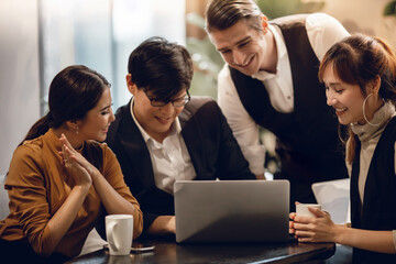 Fototapeta premium Working Together Concept. Group of Diversity Business People Working on Laptop in Office. Happy Teamwork