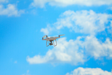 Quadrocopter on background of cloudy sky