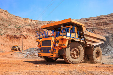 Big yellow truck in an ore quarry
