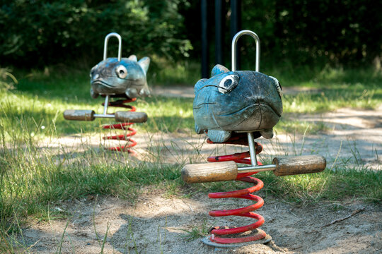 Wooden fish spring rocker in a playground