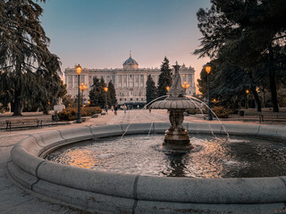 Sunset, fountain and gardens in front of the palace, Madrid