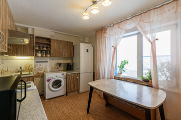 Russia, Moscow- February 10, 2020: interior room apartment modern bright cozy atmosphere. general cleaning, home decoration, kitchen, dining area