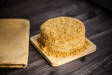 
homemade honey cake on dark wooden background