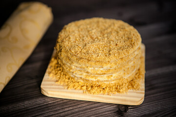 
homemade honey cake on dark wooden background