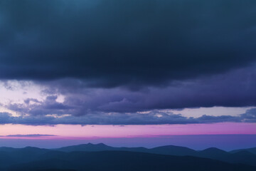 Fototapeta na wymiar Sunset in the cloudy mountains of the Carpathians