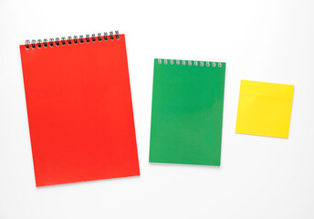 Bright colorful notepads isolated on white background.