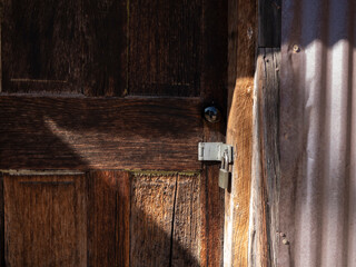 A weathered old door on a rustic building