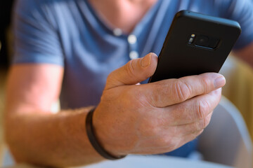 Senior handsome Scandinavian man relaxing inside the coffee shop