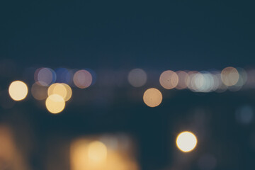 Night blur lights. Abstract of vintage bokeh background with retro effect.