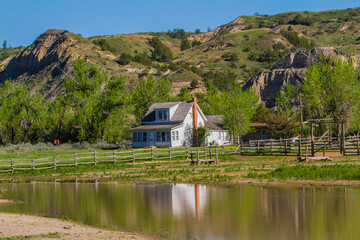Fototapeta na wymiar Ranch house and pond in Teddy Rosevelt National Park, North Dakota