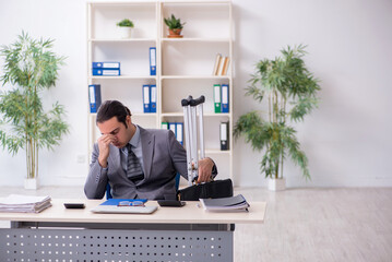 Young male employee after accident at workplace