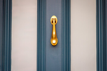 Elegant golden door knocker