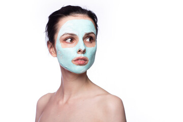 woman in cosmetic mask on her face, white background
