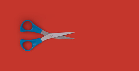 Mockup: stationery scissors isolated on red background