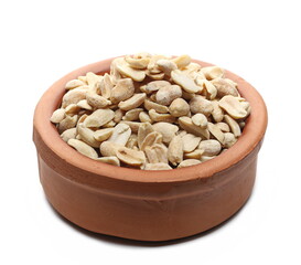 Pile salted and marinated peanuts in clay pot isolated on white background