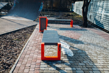 Nested pavers of various colors, around the grass is green, chic garden