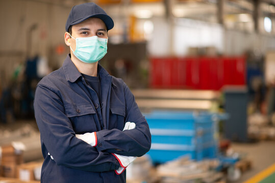 Worker in a factory wearing a mask