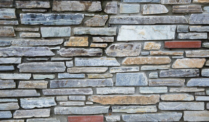 pattern of decorative stone wall background, colored stones texture