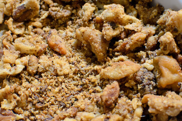 Homemade freshly crispy meaty greaves,  picked pork greaves close up. traditional winter food. delicious unhealthy fried pork greaves  top view full frame 