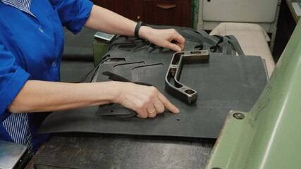 Machine manufacture rubber gasket using template, worker makes rubber parts