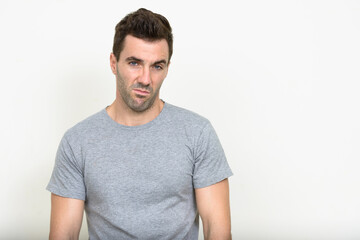 Portrait of handsome Hispanic man with beard stubble