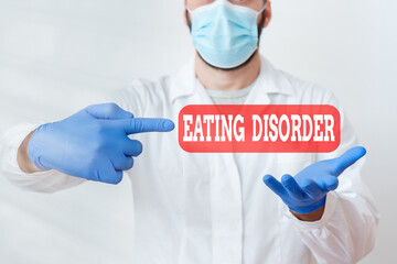 Text sign showing Eating Disorder. Business photo text illnesses or severe disturbances in their...