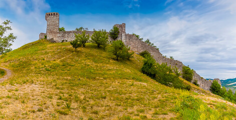 Fototapeta na wymiar A panorama view towards the Castle Rocca Maggiore above Assisi, Umbria in the summertime